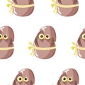 seamless pattern with an icon of a brown owl sitting in a brown egg with a bow Royalty Free Stock Photo